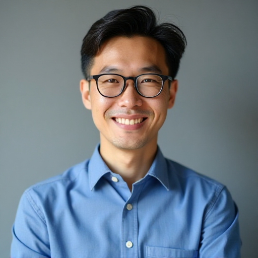 Professional headshot of Marcus Chen, an Asian man in his 30s with glasses and a professional appearance, wearing a blue button-up shirt